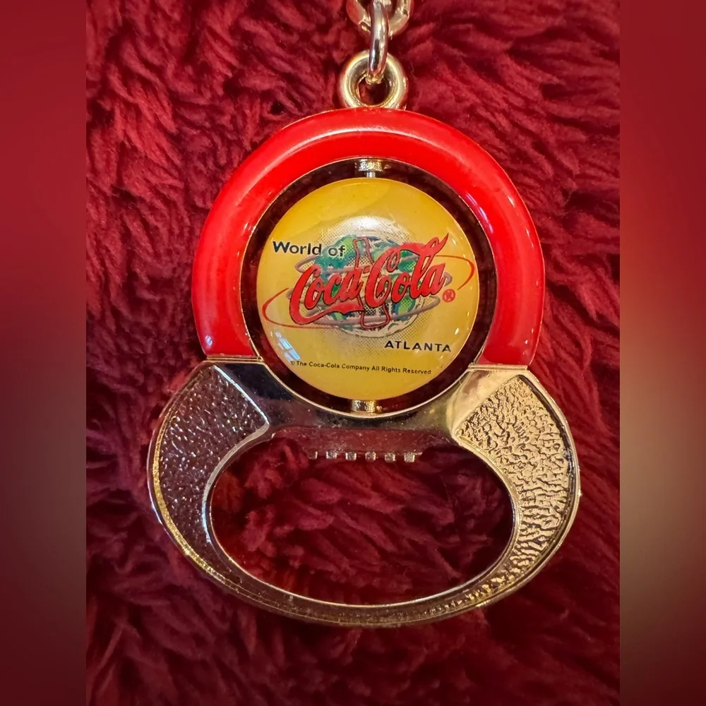 NWOT Vintage Coca Cola Keychain/ Bottle Opener Spinner  In Gold, Red And Yellow.